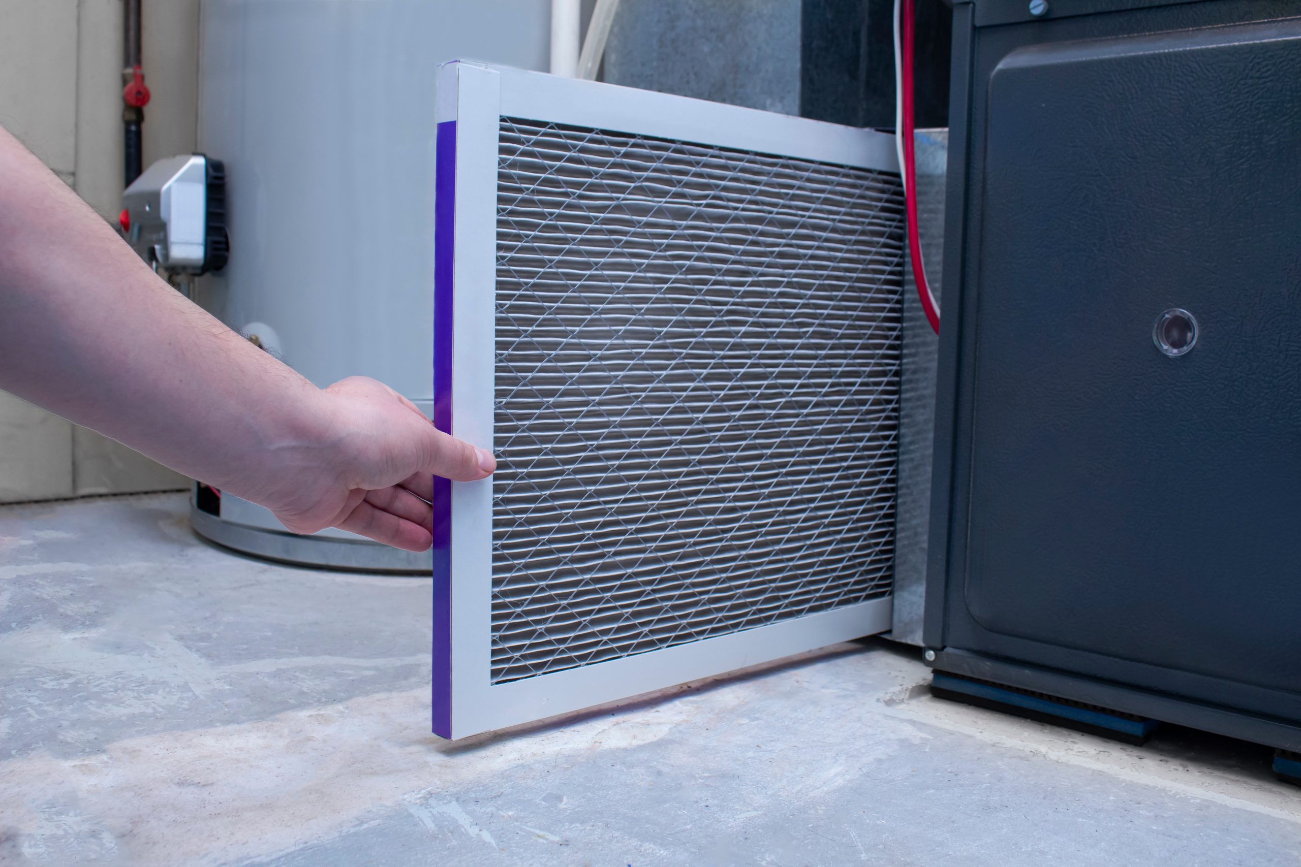 Replacing a filter in a home furnace
